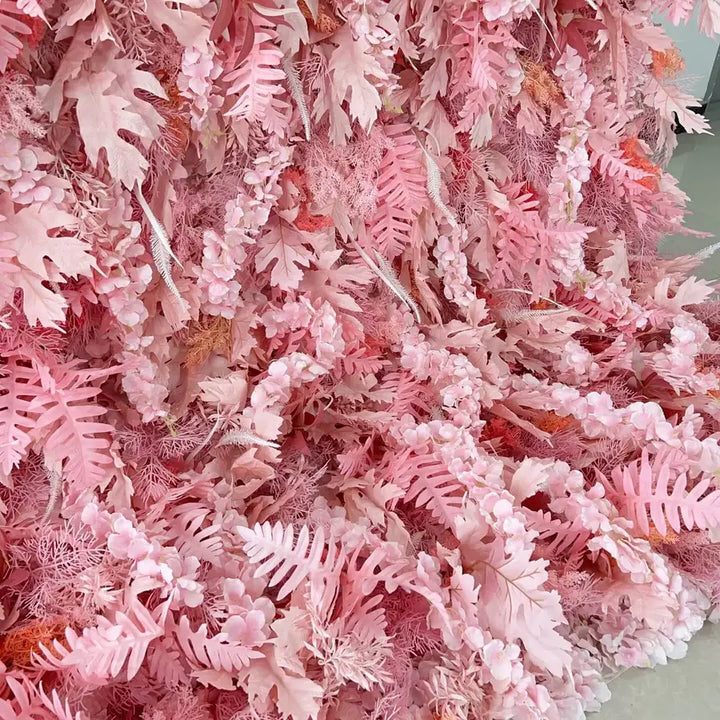 Bottom detail of cascading pink leaves in floral wall backdrop