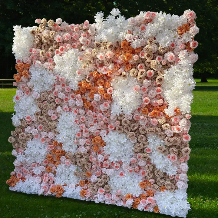 Full display of an elegant blush-toned decorative flower wall at an outdoor event.