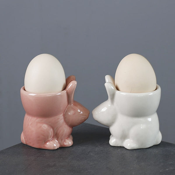 Pink ceramic bunny egg cup with soft-boiled egg inside