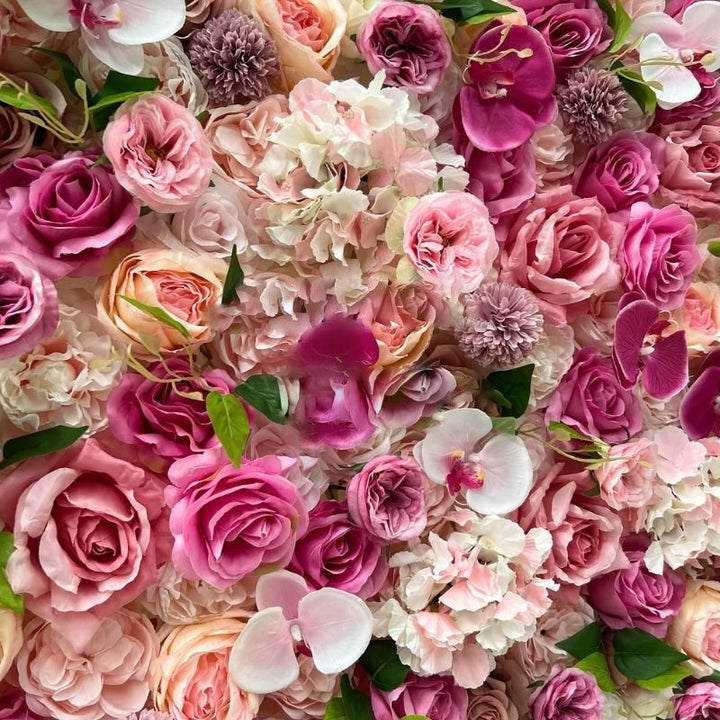 Vibrant floral wall featuring a rich array of pink roses perfect for weddings and special occasions.
