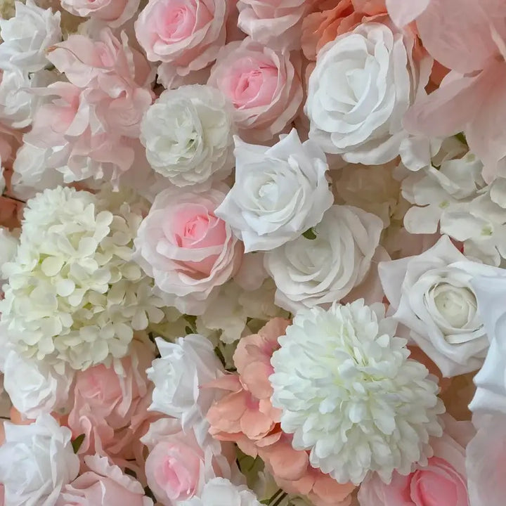 Full display of blush and ivory decorative flower wall ideal for wedding or party decor.