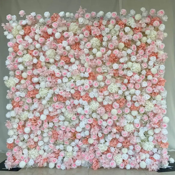 Close-up of blush, peach, and white roses with hydrangeas in a pastel flower wall.