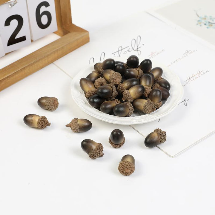 100pcs Artificial Mini Acorns for Crafts is a perfect addition to your florist supply collection.