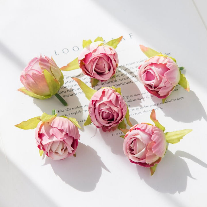 10Pcs Silk Rose Buds Flower Head Artificial Flowers is a perfect addition to your floral supplies collection.