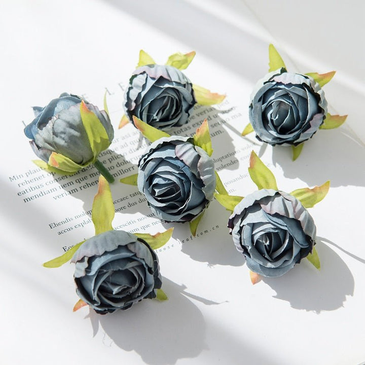 10Pcs Silk Rose Buds Flower Head Artificial Flowers is a perfect addition to your floral supplies collection.