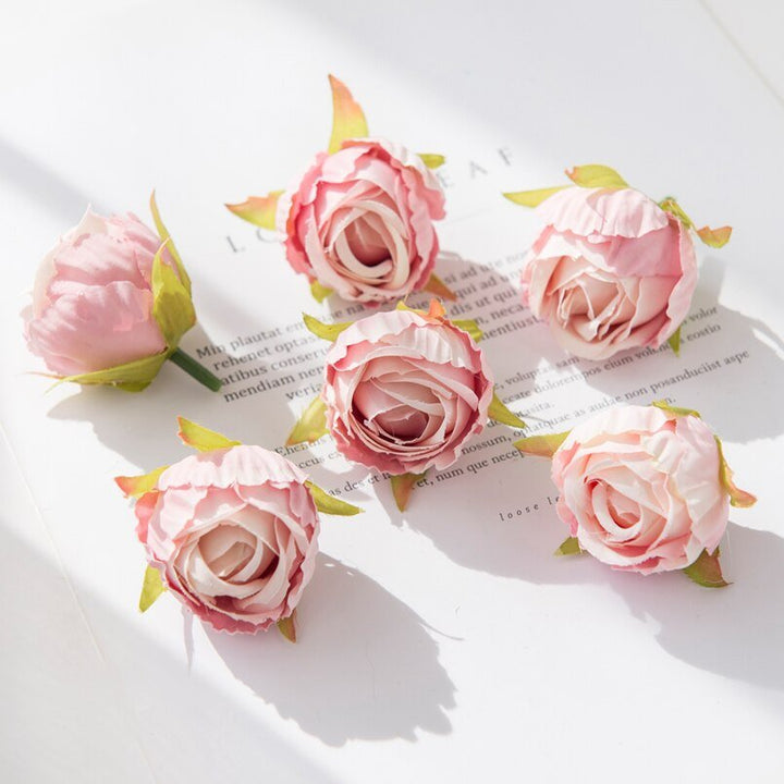 10Pcs Silk Rose Buds Flower Head Artificial Flowers is a perfect addition to your florist supplies collection.