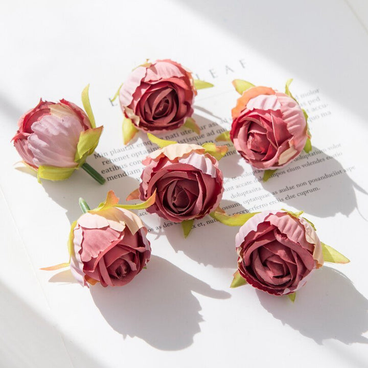 10Pcs Silk Rose Buds Flower Head Artificial Flowers is a perfect addition to your floral supplies collection.