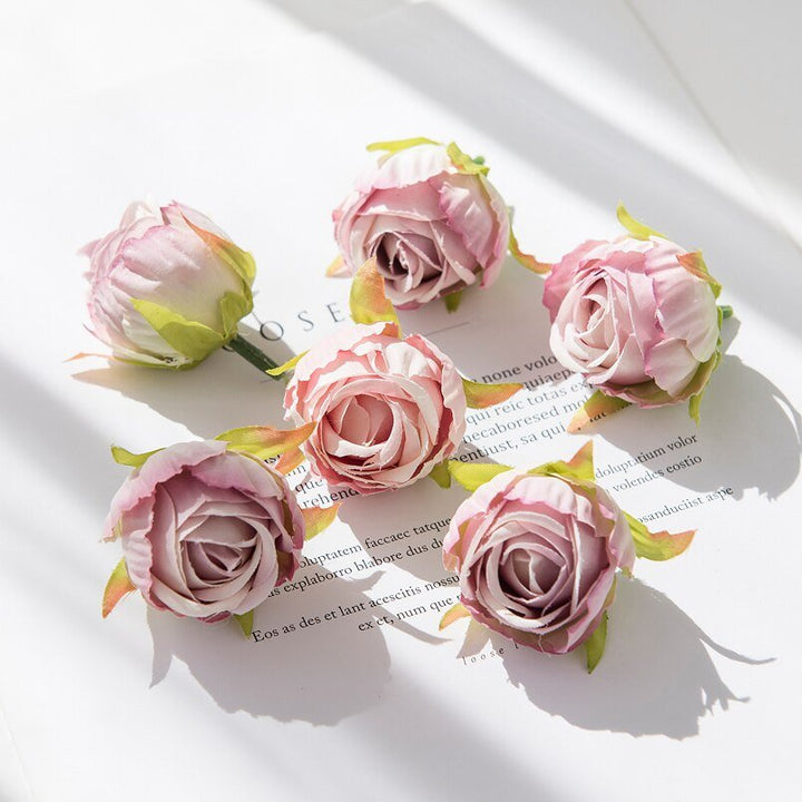 10Pcs Silk Rose Buds Flower Head Artificial Flowers is a perfect addition to your floral supplies collection.