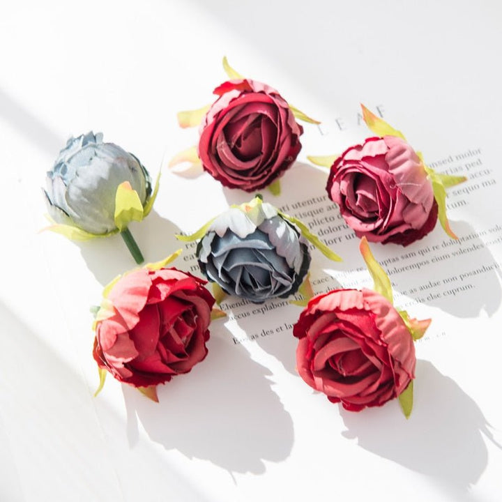 10Pcs Silk Rose Buds Flower Head Artificial Flowers is a perfect addition to your florist supply collection.