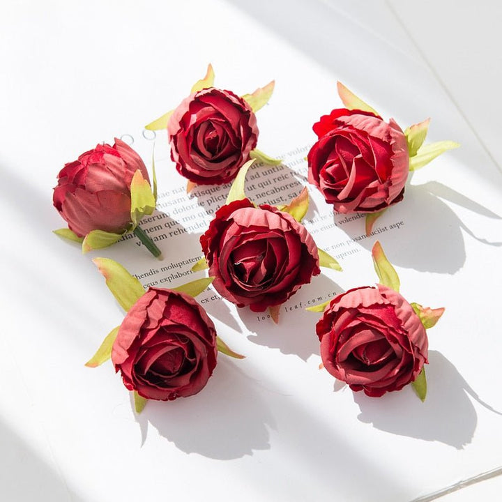 10Pcs Silk Rose Buds Flower Head Artificial Flowers is a perfect addition to your florist supplies collection.