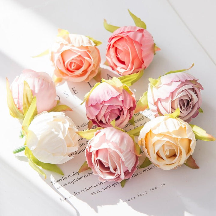 10Pcs Silk Rose Buds Flower Head Artificial Flowers is a perfect addition to your florist supply collection.