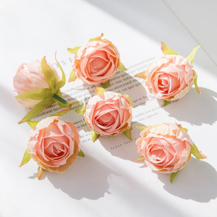 10Pcs Silk Rose Buds Flower Head Artificial Flowers is a perfect addition to your florist supplies collection.