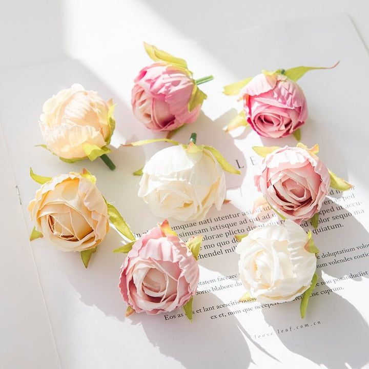 10Pcs Silk Rose Buds Flower Head Artificial Flowers is a perfect addition to your florist supply collection.