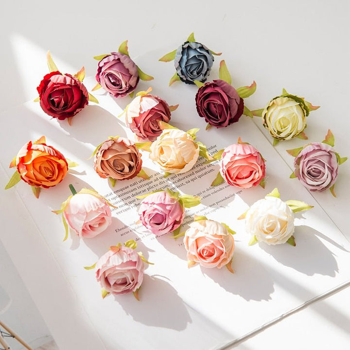 10Pcs Silk Rose Buds Flower Head Artificial Flowers is a perfect addition to your decorative floral collection.