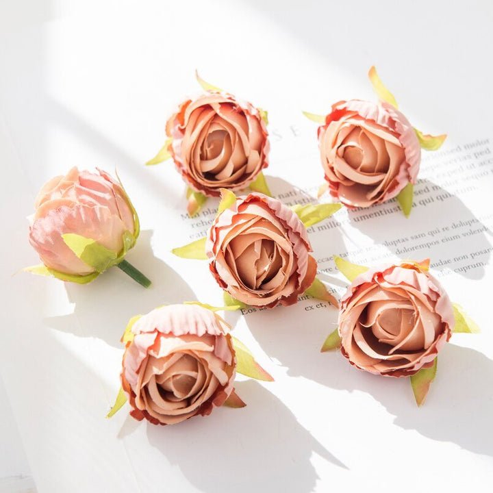 10Pcs Silk Rose Buds Flower Head Artificial Flowers is a perfect addition to your floral supplies collection.