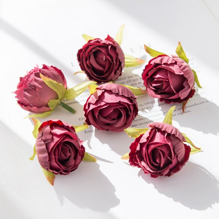 10Pcs Silk Rose Buds Flower Head Artificial Flowers is a perfect addition to your floral supply collection.