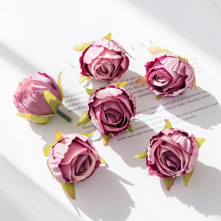 10Pcs Silk Rose Buds Flower Head Artificial Flowers is a perfect addition to your floral supplies collection.