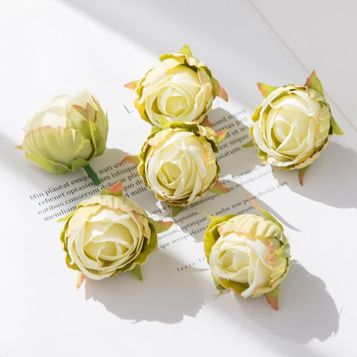 10Pcs Silk Rose Buds Flower Head Artificial Flowers is a perfect addition to your floral supply collection.