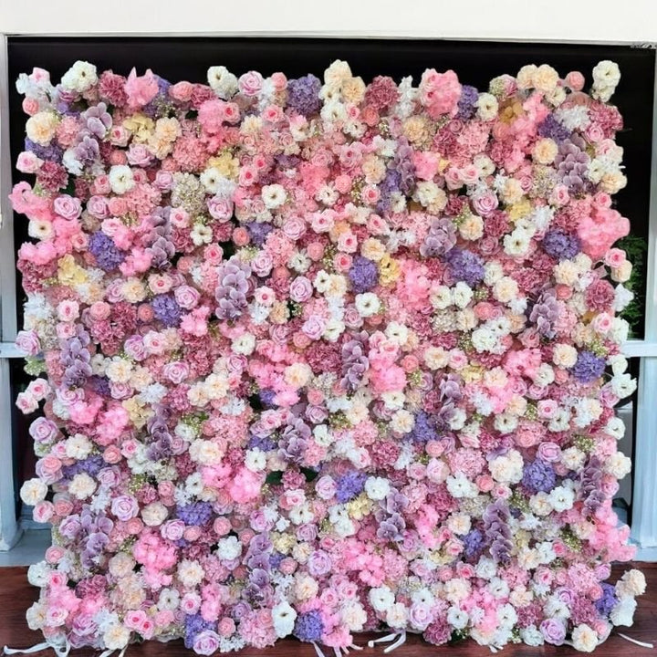Vibrant flower wall backdrop filled with pink and purple blooms for special events