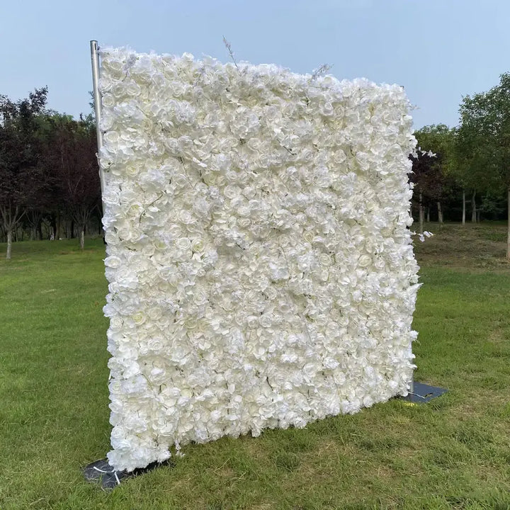 Angled shot of white flower backdrop with surrounding park scenery.