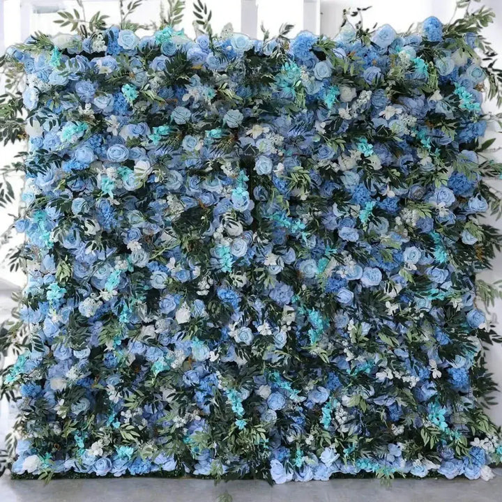 Blue flower wall backdrop with roses and greenery for wedding decorations.