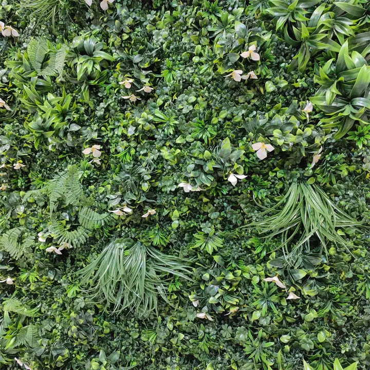 Decorative flower wall featuring lush green plants for a natural event backdrop.