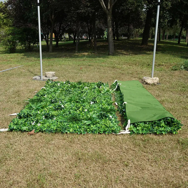 Close-up view of a vibrant green flower wall with foliage for parties and events.