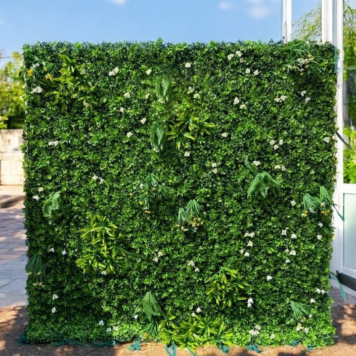 Greenery flower wall backdrop perfect for weddings and celebrations.