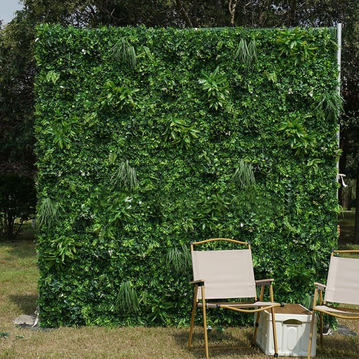 Lush greenery flower wall backdrop for wedding and event decoration.