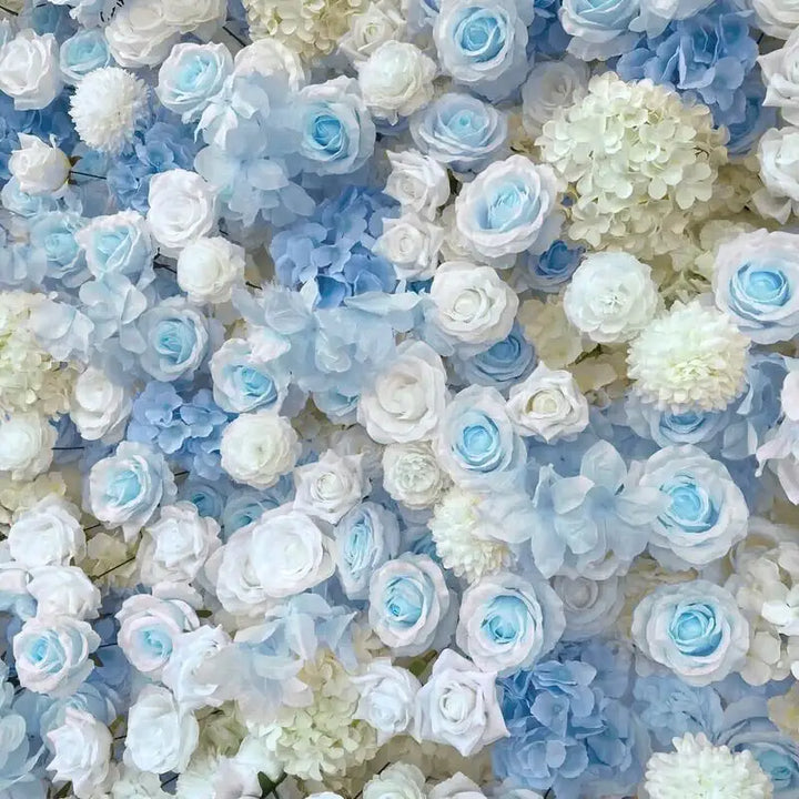 Close-up of blue and white roses in a decorative flower wall for events.