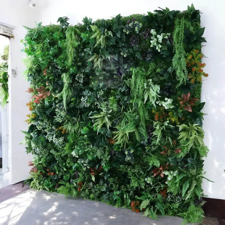 Lush greenery wall backdrop displayed outdoors, ideal for creating a naturalistic setting at events.