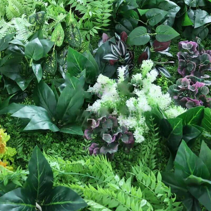 Full view of a vibrant greenery wall, perfect for adding a jungle theme to parties and events.