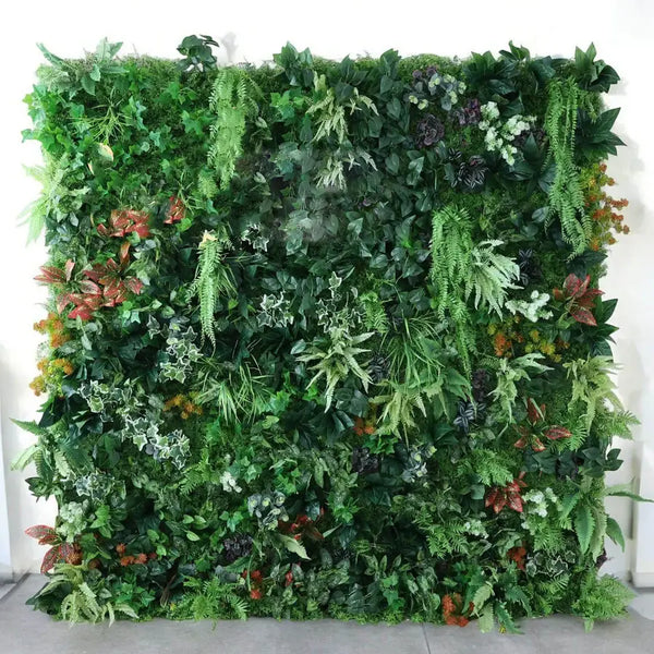 Exotic Jungle-Inspired Greenery Wall featuring a rich assortment of ferns and tropical leaves for weddings.