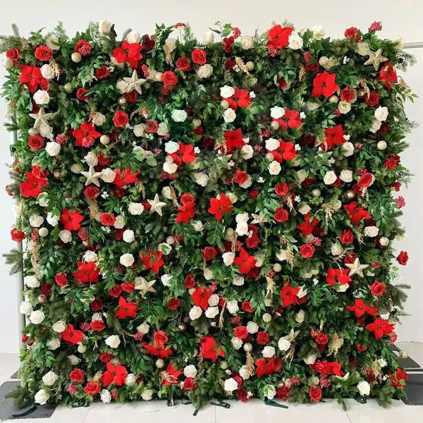 Red and white Christmas flower wall backdrop with poinsettias and greenery for holiday events.