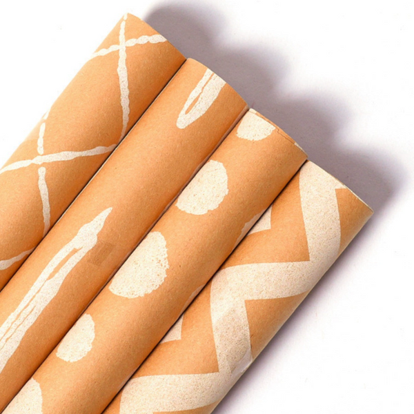 Vintage kraft wrapping paper with geometric designs for gifts.
