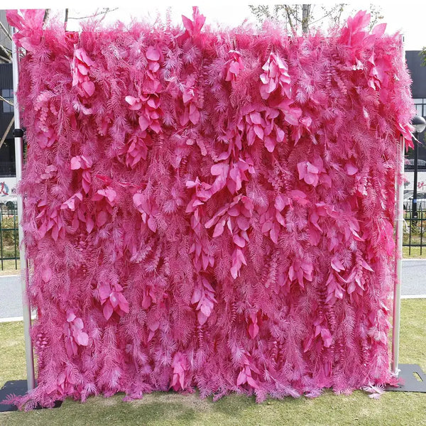 Bold pink flower wall backdrop with cascading fern textures for weddings and events