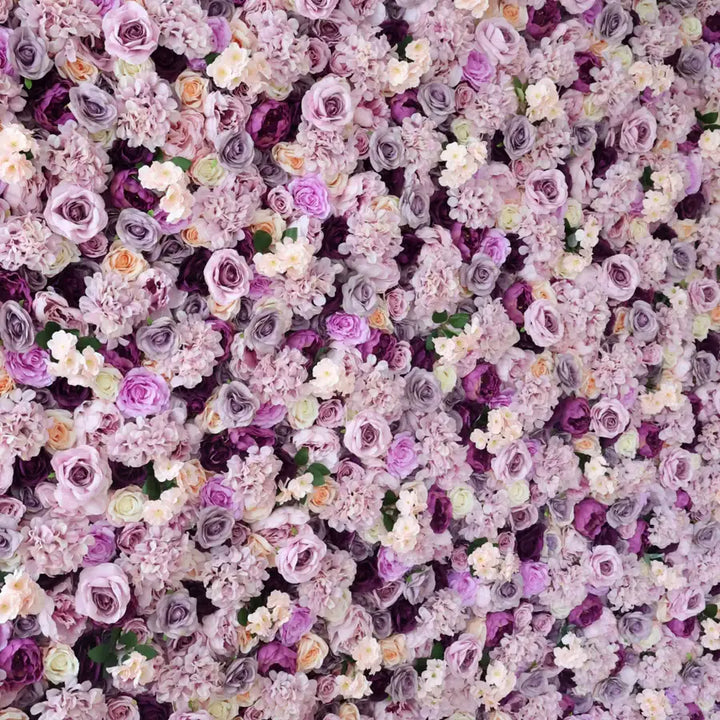 Floral wall backdrop featuring lavender and rose flowers for a sophisticated event.