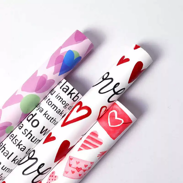 Romantic "I Love You" wrapping paper with hearts and love letters.