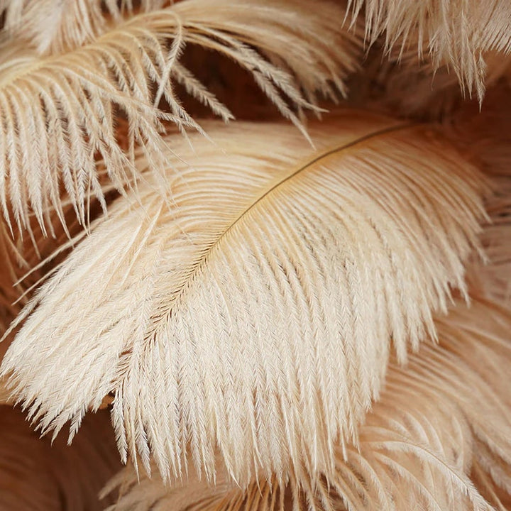 Warm beige pampas grass wall backdrop adding a boho-chic touch.
