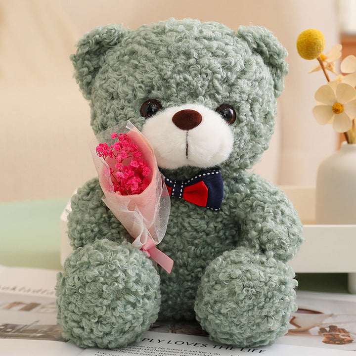 Teddy Bear Holding Bouquet 25cm is a delightful addition to your valentine's day flowers collection.