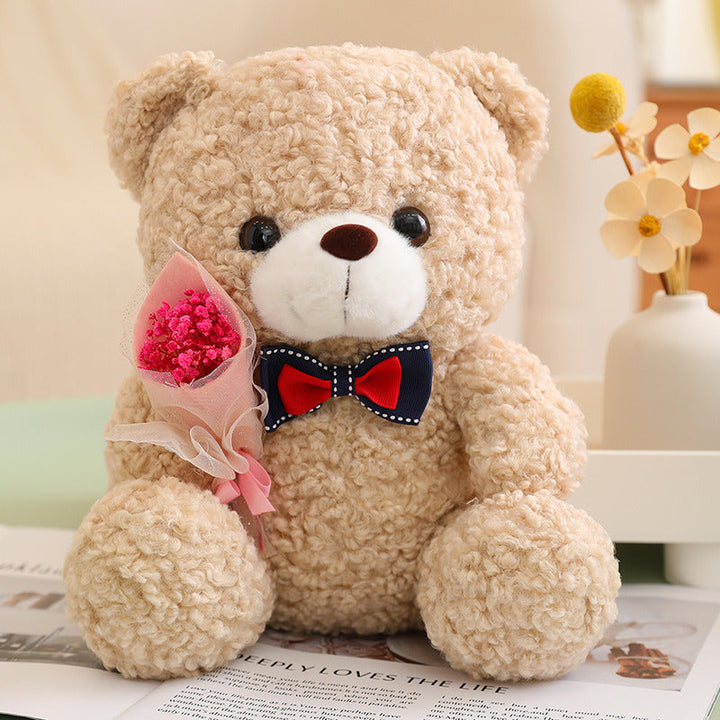 Teddy Bear Holding Bouquet 25cm is a delightful addition to your valentine flowers collection.