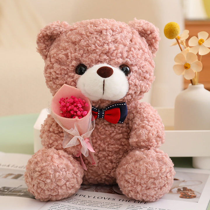 Teddy Bear Holding Bouquet 25cm is a delightful addition to your valentine flower collection.