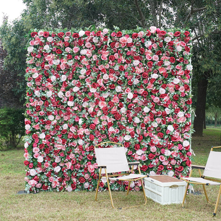 Rose Garden Romance flower wall backdrop with red and blush roses.
