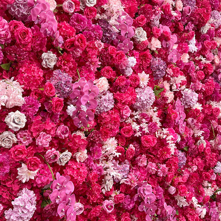 Luxurious hot pink and purple flower wall for weddings and events.
