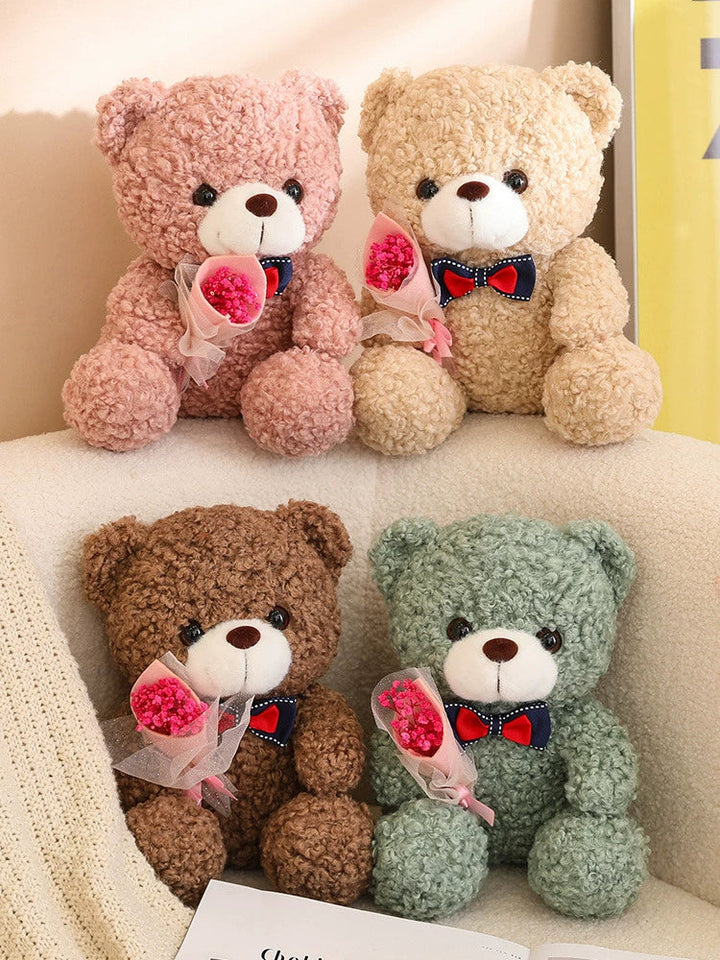 Teddy Bear Holding Bouquet 25cm is a delightful addition to your valentine's gifts collection.