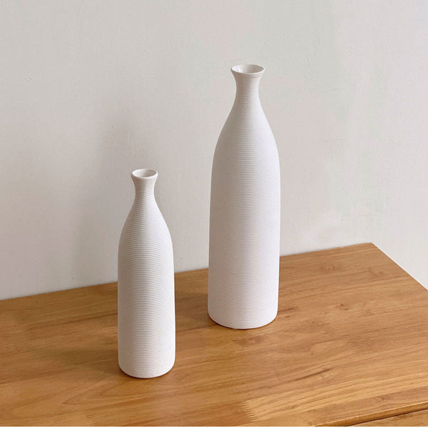 White ceramic vase set in modern minimalist style