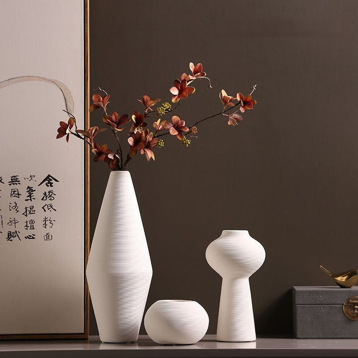 Set of textured white ceramic vases in various sizes
