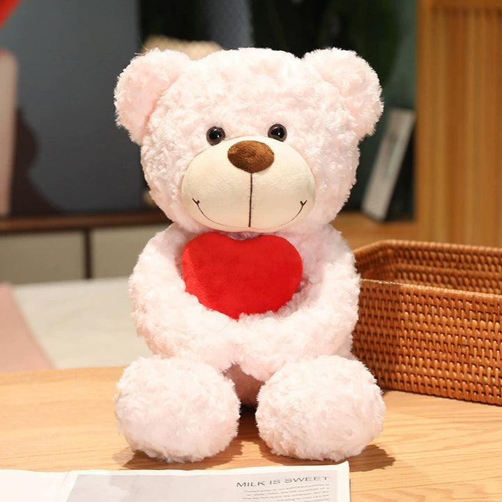 Teddy Bear Embracing Red Heart 45cm is a delightful addition to your valentine flower collection.