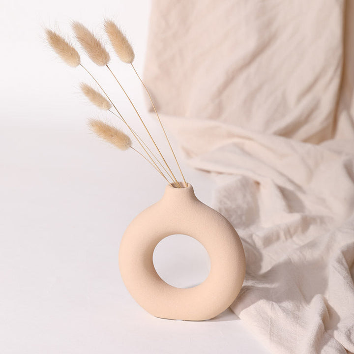 Scandinavian-inspired circular ceramic vases on display