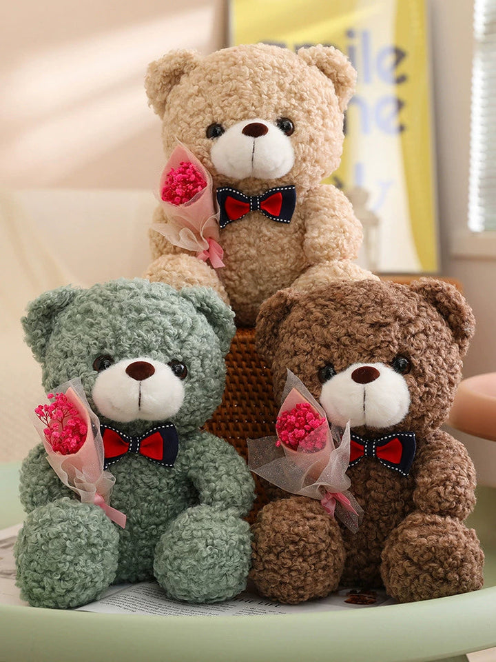 Teddy Bear Holding Bouquet 25cm is a delightful addition to your valentine's gifts collection.